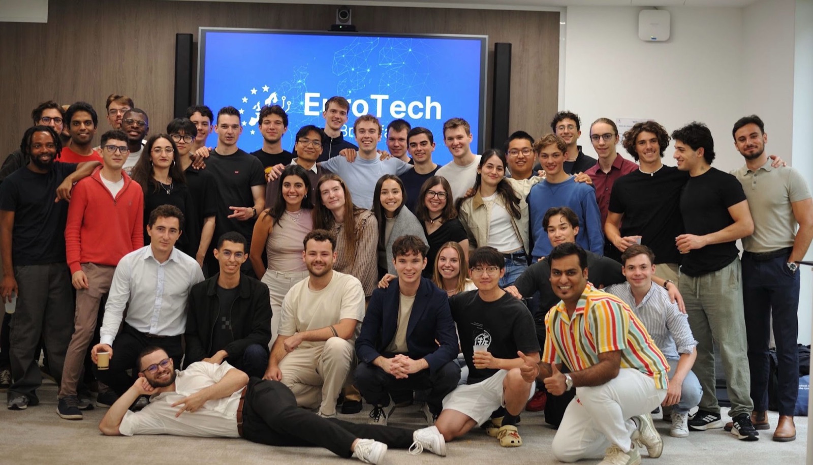 Fellows gathered in front of the EuroTech screen at the first summit